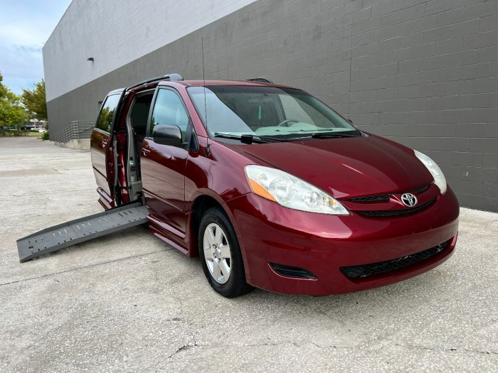 Red 2010 Toyota Sienna wheelchair van viewed from the front angle