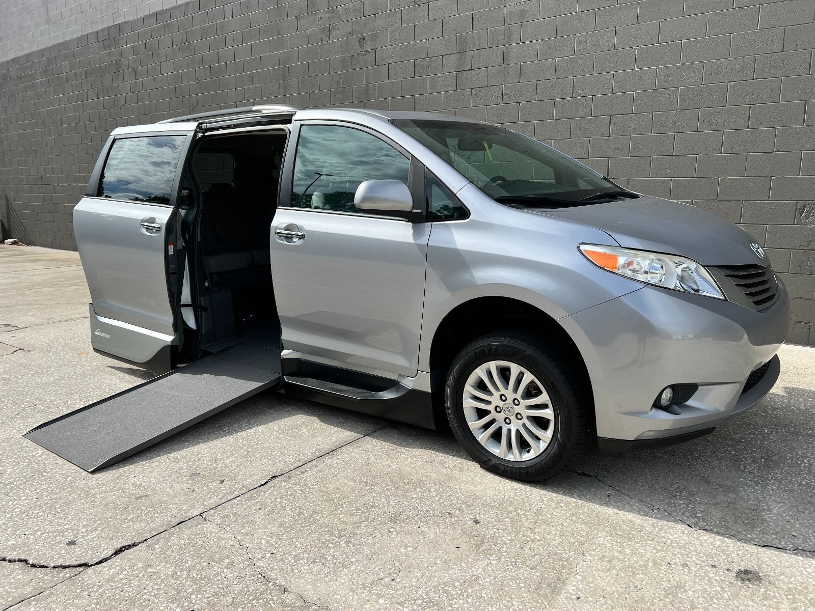 Silver Toyota Sienna wheelchair van viewed from the front corner angle