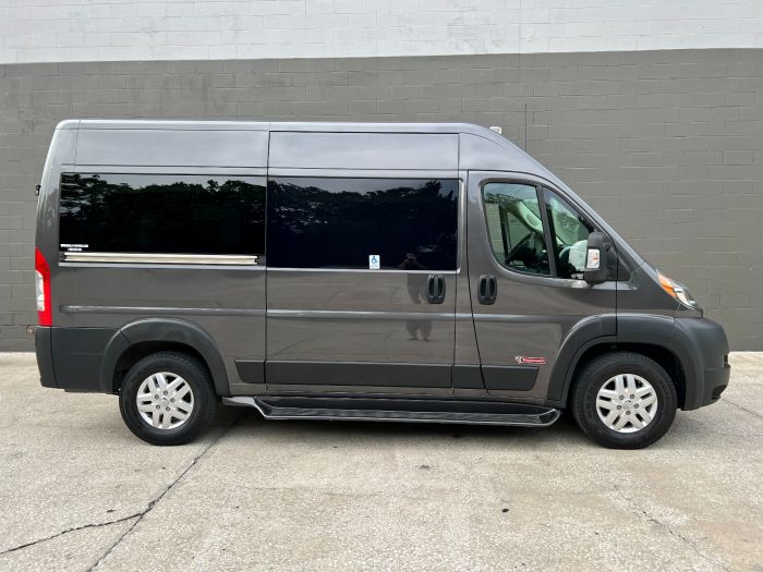 Gray Ram ProMaster Full Size Wheelchair Van with Tempest X-HT Conversion, showing the passenger side.